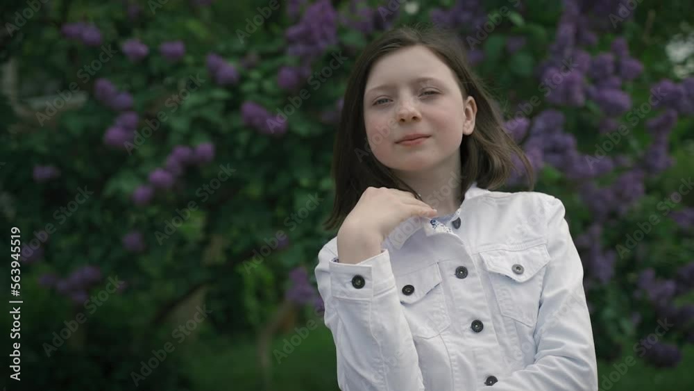 mysterious and dreamy girl against the background of blooming lilac. mysterious and dreamy girl against the background of blooming lilac.