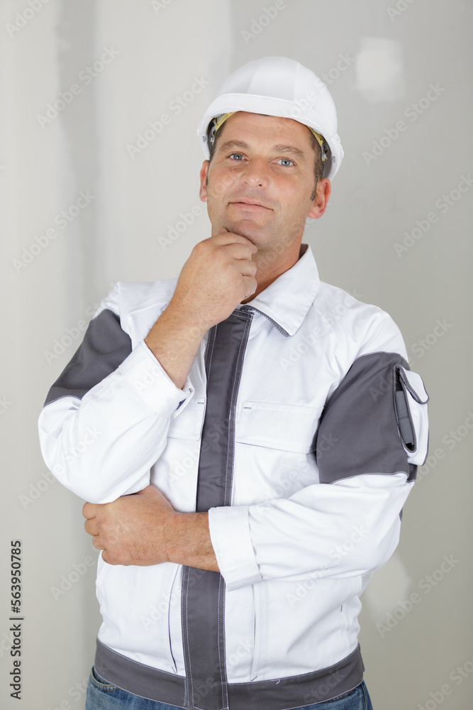 portrait of a thinking builder in uniform portrait of a thinking builder in uniform