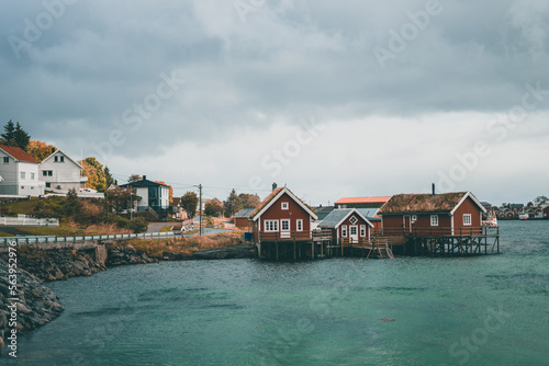 Typical red wooden houses at the harbor, on the Lofoten Islands in Norway - during an beautiful autumn day