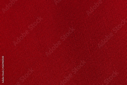 Texture of natural red fabric. Fabric background from natural cotton or linen textile material. Red canvas background.