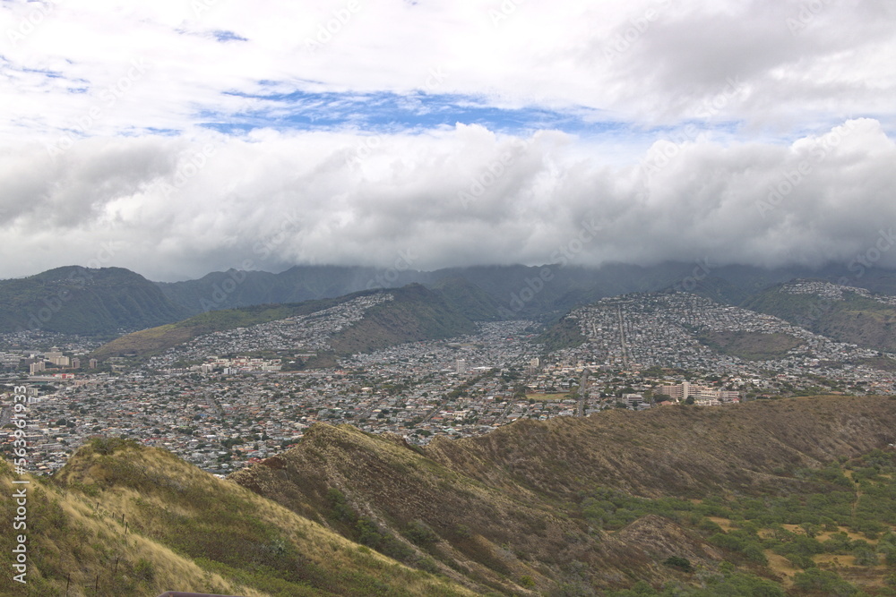 Clouds cover the Koolau mountain range just behind the residential neighborhoods of Honolulu