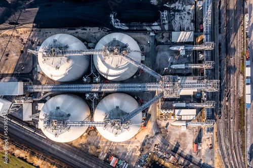 Aerial view directly above large biomass storage tanks at a Power Station