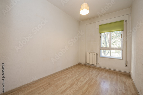 Wallpaper Mural Small empty room with laminated flooring, aluminum window with green roller blind and white aluminum radiator Torontodigital.ca