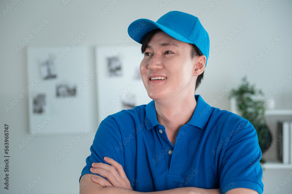 An Asian young Technician service man wearing blue uniform checking electrical appliances in home An Asian young Technician service man wearing blue uniform checking electrical appliances in home
