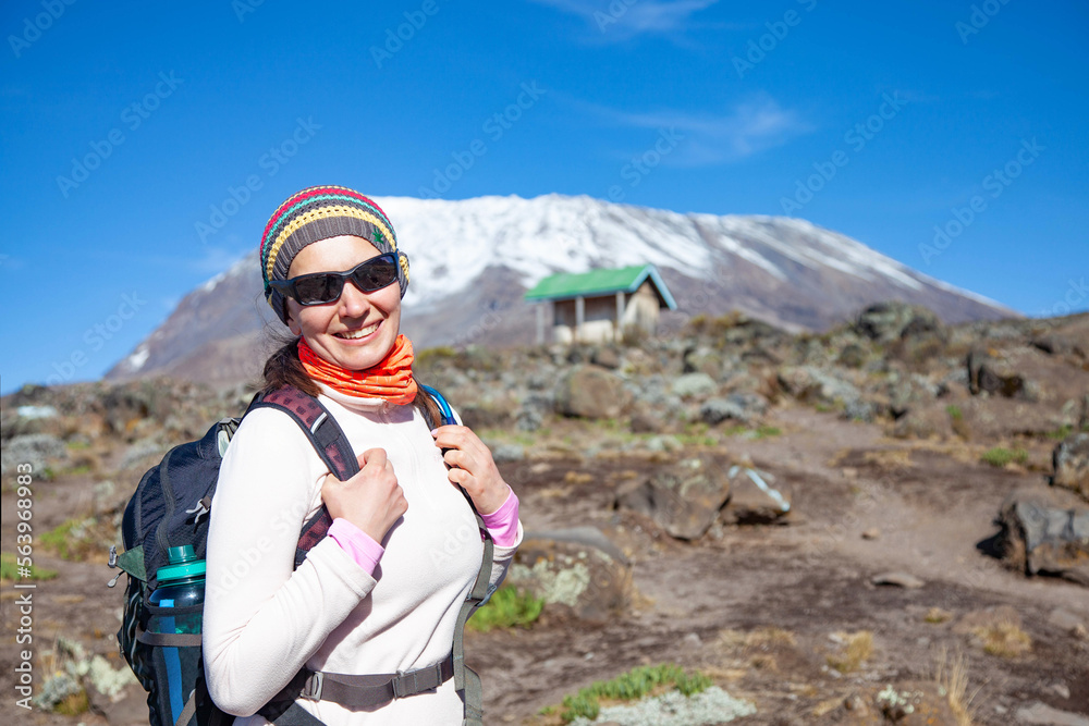 Female backpacker on the trek to Kilimanjaro mountain.