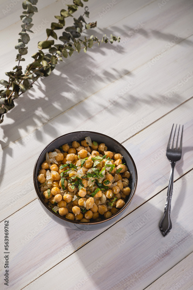 Bowl of cooked chickpeas with white background Bowl of cooked chickpeas with white background