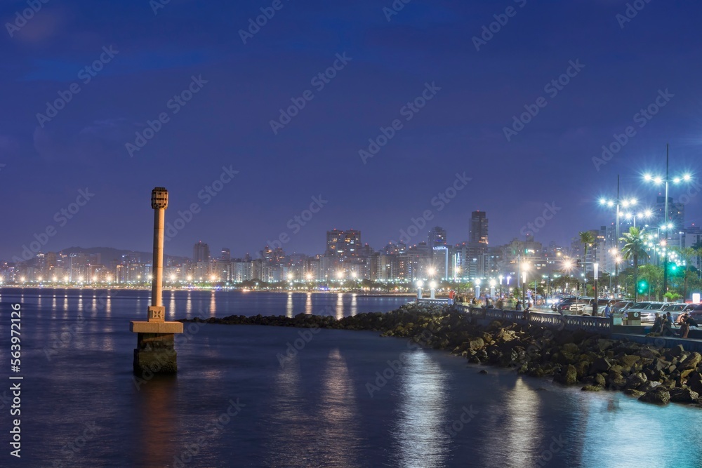 Santos, Brazil. Beachfront illuminated at night. Standard landmark monument of the city.