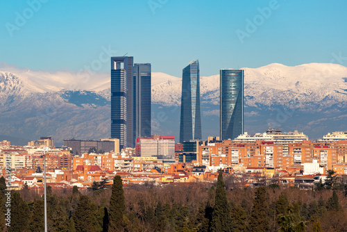 Madrid. Skyline of the city of Madrid with the Sierra de Guadarrama. White mountain full of white snow. City concept. Winter concept. Photography. Madrid photography. Panoramic photography. Panoramic.