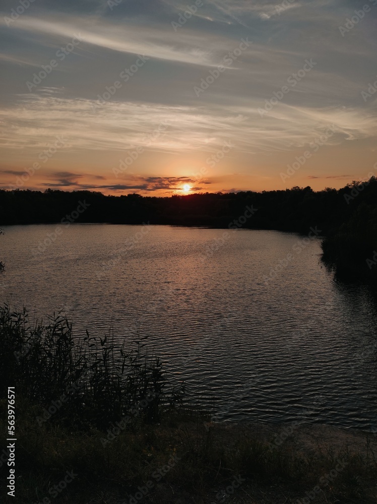 Obraz premium sunset over the river