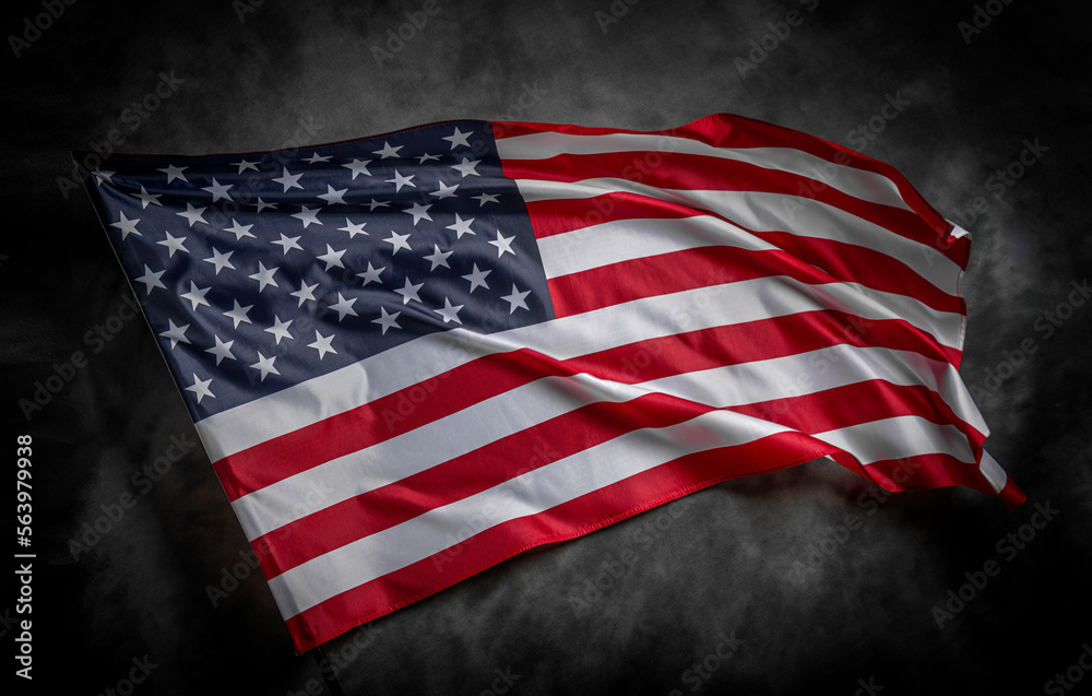 Obraz premium American flag on dark background. USA flag on a black background.