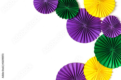 Mardi gras.Holidays mardi gras masquarade  venetian mask fan over purple background. view above mardi gras background copy space Happy Mardi Gras . Fat Tuesday carnival texture golden green purple