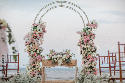 Fototapeta Naklejka Na Ścianę i Meble -  Wedding set up on beach. Beautiful tropical outdoor ceremony or party with ocean view. Destination weddings concept