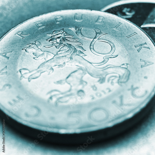 Translation: 50 crowns Czech Republic. Turquoise tinted square coin illustration for news about economy or finance. Czech koruna close-up. Central bank and national currency of Czechia. Macro