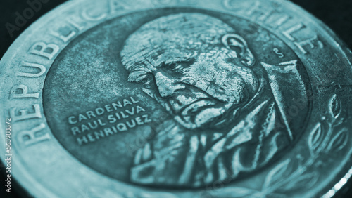 Coin of 500 Chilean pesos сlose-up. Peso of Chile. News about economy or banking. Loan and credit. Wages and money. Turquoise tinted wallpaper or background. Macro