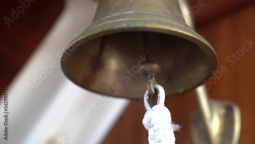 Sound the bell on the yacht. Slow motion