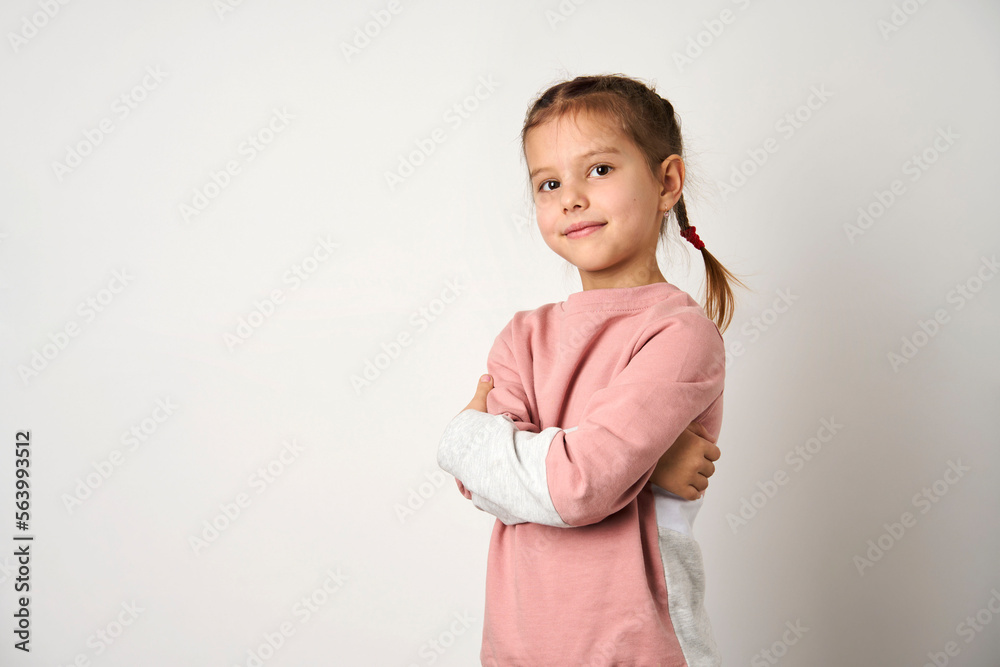 Portrait of cute girl with crossing hands on white background Portrait of cute girl with crossing hands on white background