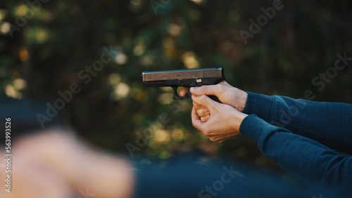 Training. Men shooting a gun. High quality photo