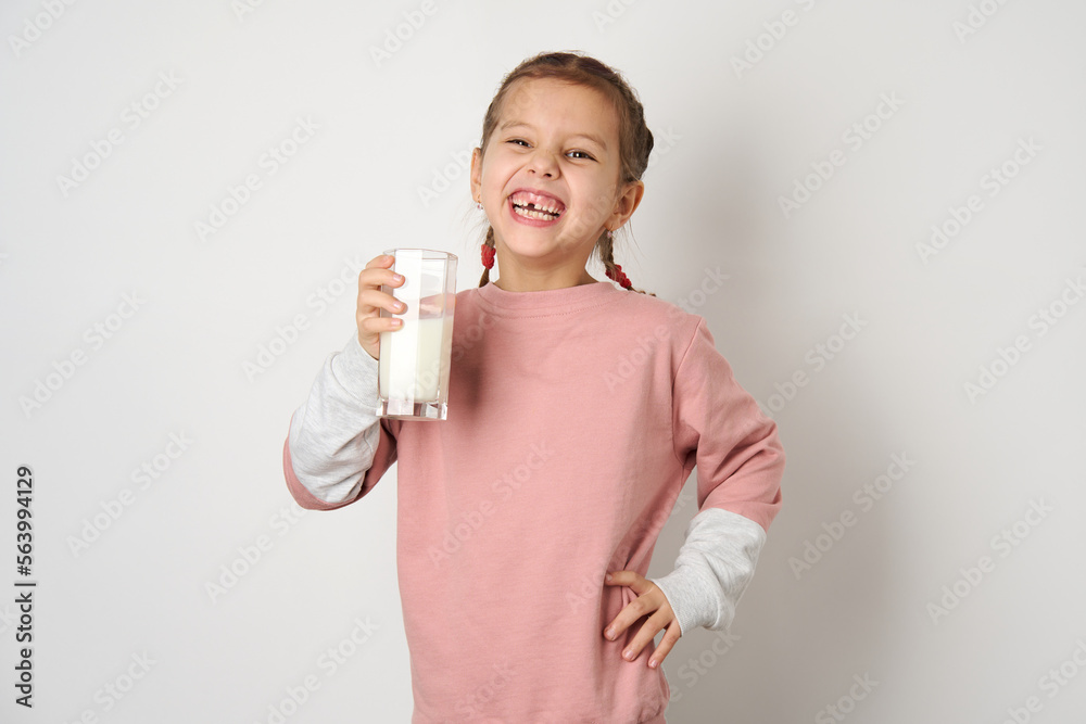 Portrait of little girl with a glass of milk, close-up Portrait of little girl with a glass of milk, close-up