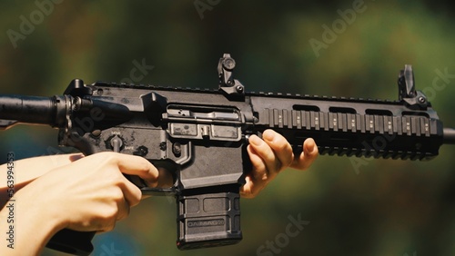 Hands of a man holding a gun carbine. High quality photo
