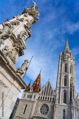 Beautiful Matyas templom Matthias church in Buda castle Budapest with blue sky with trinity statue photo