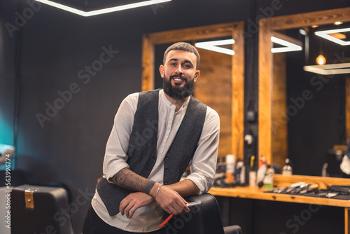 Dark-haired bearded man in a stylish outfit