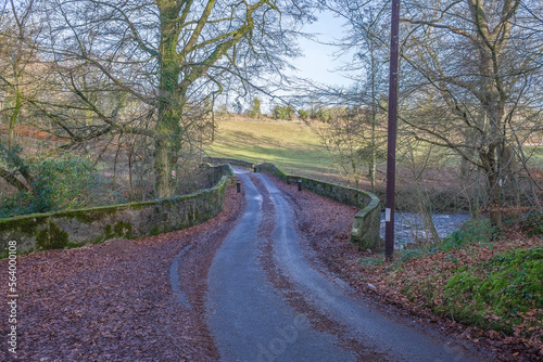 Scottish Road running over an ancient single lane bridge at the heart of Burns country photo