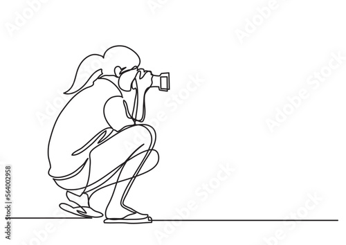 continuous line drawing vector illustration with FULLY EDITABLE STROKE of woman making photos with camera