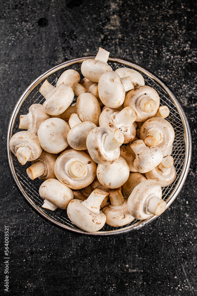 Fresh mushrooms in a colander. Fresh mushrooms in a colander.