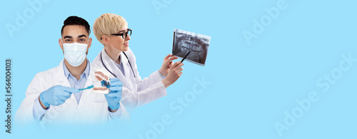 picture of multiracial group of doctors dentists on blue