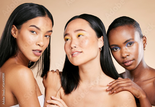 Diversity, skincare and women with cosmetics, dermatology and wellness on brown studio background. Makeup, multiracial and ladies with healthy, smooth and clear skin for confidence and wellness