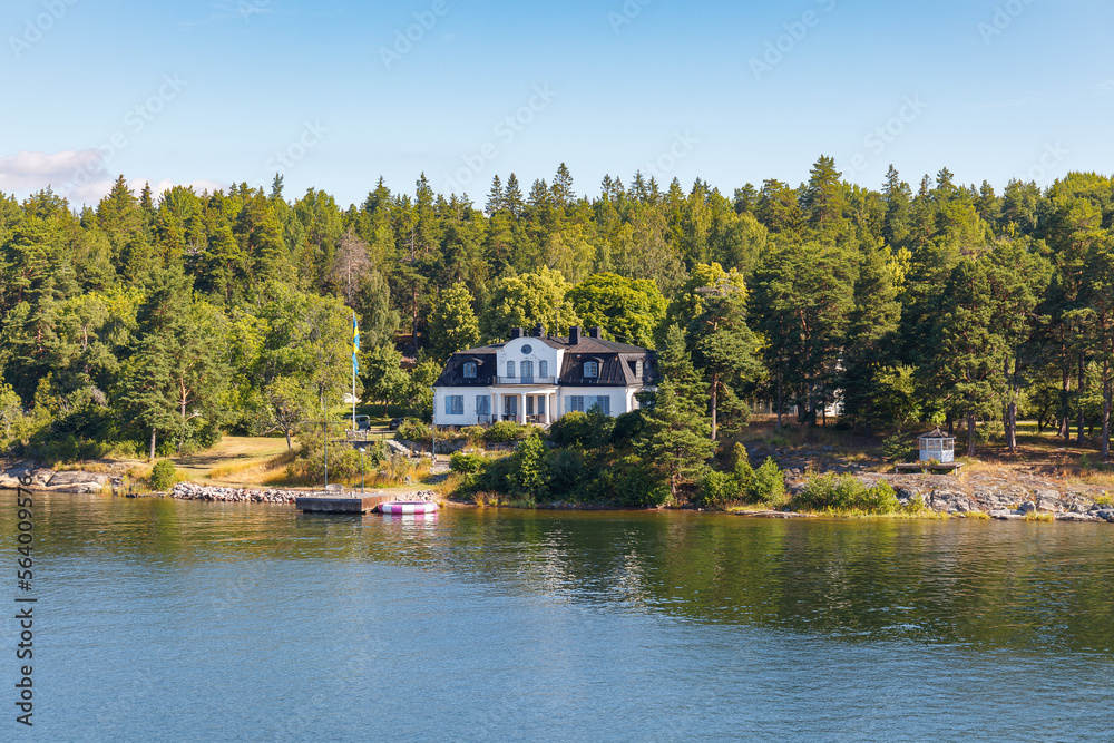 Fototapeta premium Stockholm Archipelago, view from the cruise ship. Cottages on the shore