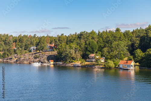 Stockholm Archipelago, view from the cruise ship. Cottages on the shore