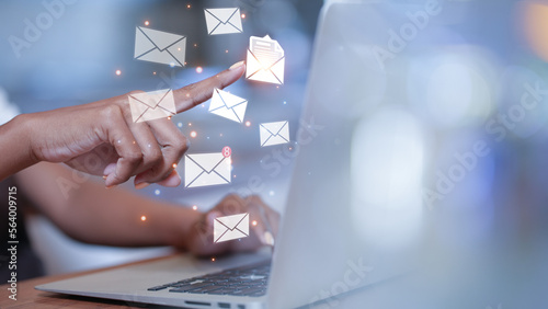 businesswoman checking message box on laptop and send email. email marketing concept, Closeup Woman hand using Laptop pc with email icon. Email concept. Mail Online Message. e-mail icon.