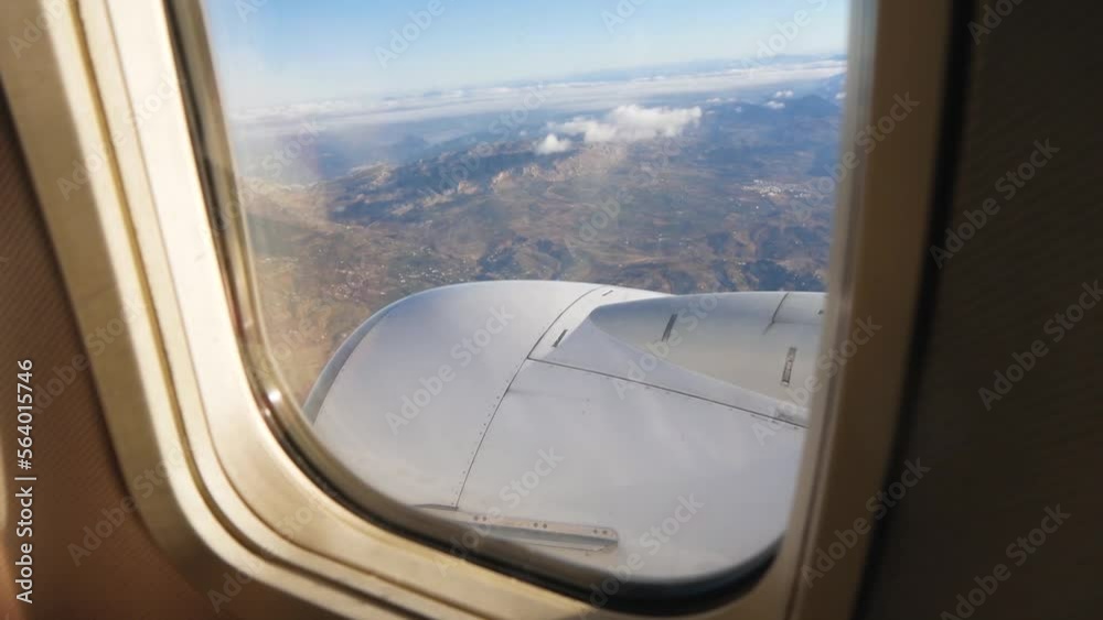 View From The Passenger Plane Porthole Of The Turbine And The Landscape Below View From The Passenger Plane Porthole Of The Turbine And The Landscape Below