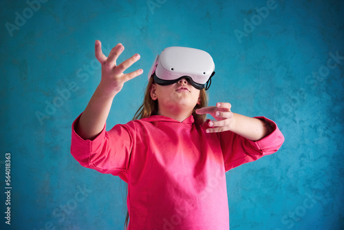 little girl playing with VR glasses