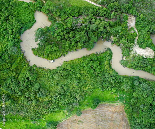 Aerial View of Piracanjuba River, Aerial View of Piracanjuba River, in the Brazilian Cerrado region in Minas Gerais, where gold mining is carried out by illegal miners. Brazil, July 2020. photo