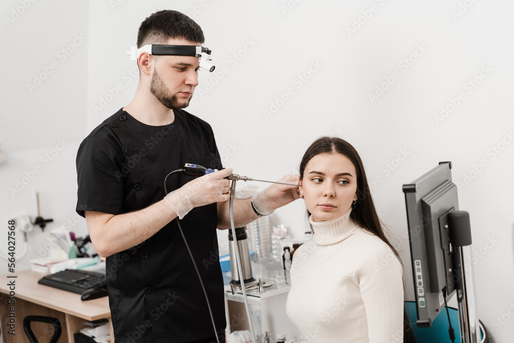 Ear endoscopy. Ears endoscopy procedure with endoscope. ENT doctor