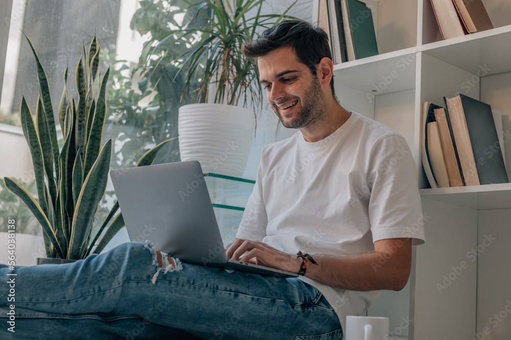 young man at home with laptop young man at home with laptop
