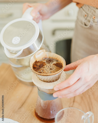 Wallpaper Mural woman makes coffee in morning for breakfast, brew drip purover. americano cappuccino. croissant for lunch, happy woman has lunch and enjoys. lifestyle, the concept of free life. cozy house Torontodigital.ca