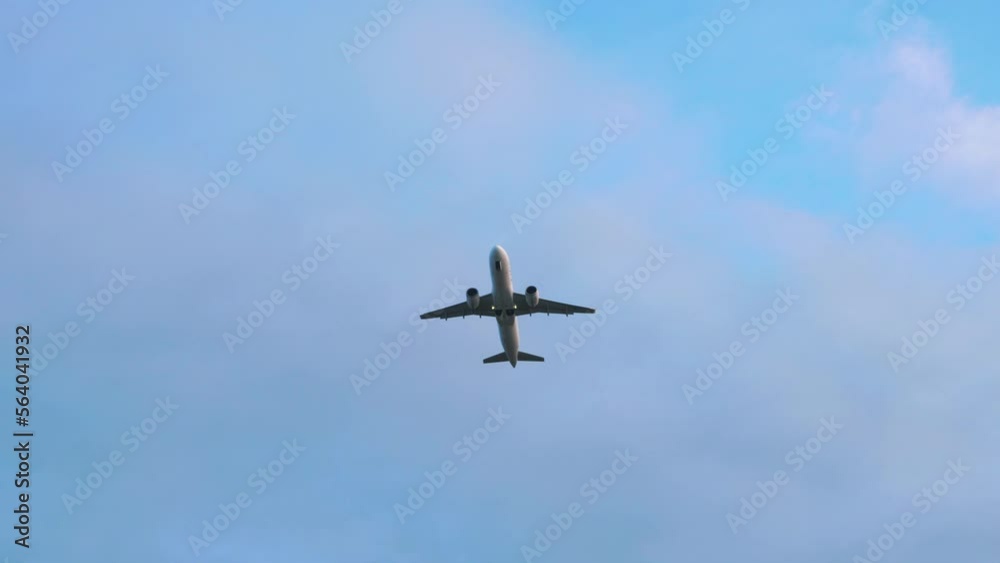 Passenger plane flies in sky, view from below. Airplane travel concept. Passenger plane flies in sky, view from below. Airplane travel concept.
