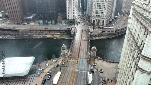 Aerial drone view flying in downtown Chicago loop over Magnificent Mile on cold snowy winter day photo