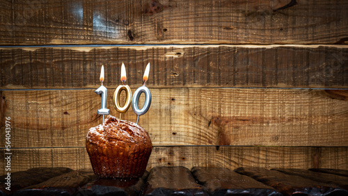 Photography Background happy birthday pie or muffin with candles burning digit number  100