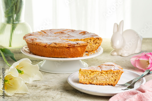 Italian Easter cake. Pastiera Napoletana. Traditionally made with pre-cooked wheat grains, grano cotto, ricotta cheese and orange flower water. Easter table.