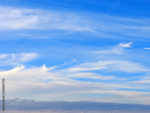 Blue sky with fluffy white clouds, neutral background for your artwork