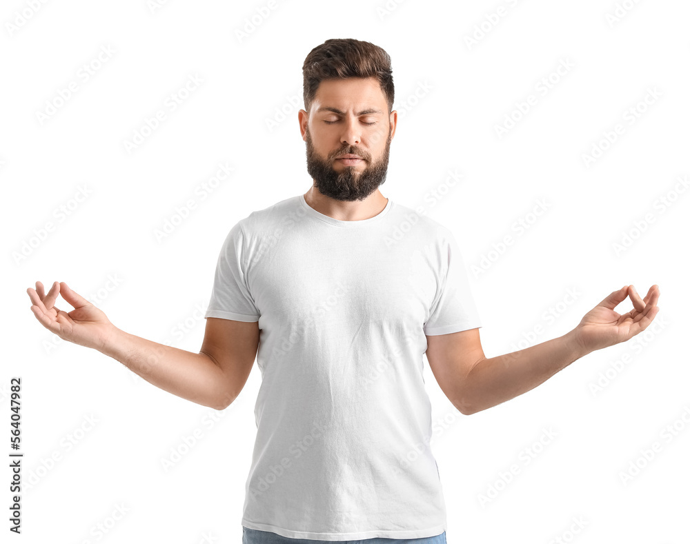Handsome bearded man meditating on white background Handsome bearded man meditating on white background