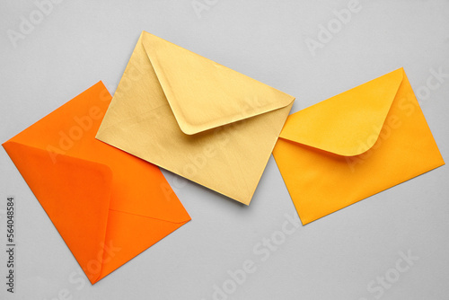 Colorful paper envelopes on light background