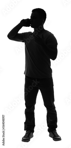 Silhouette of young man tal...