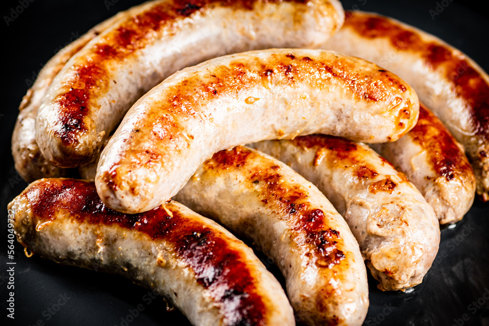 Ready grilled sausages on a plate. Ready grilled sausages on a plate.