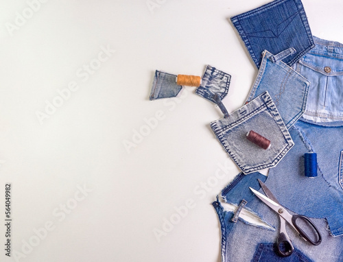 Old jeans ready to upcycling. Concept of things reuse and natural resources preserving.