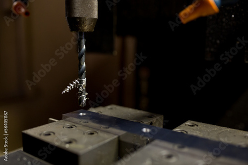 Part machining with drilling machine